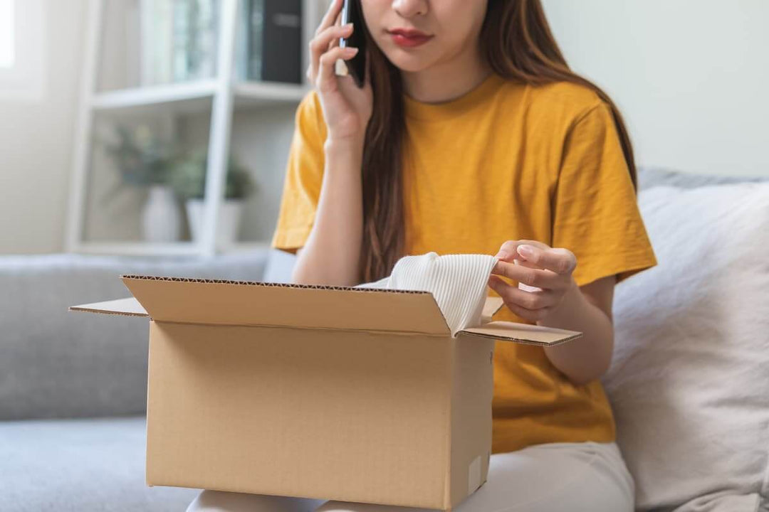 woman opening box